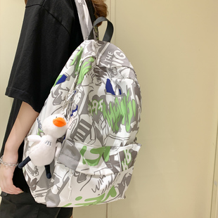 涂鴉印花雙肩包女2024新款 潮流休閑背包男高中大學生書包女 夏韓版